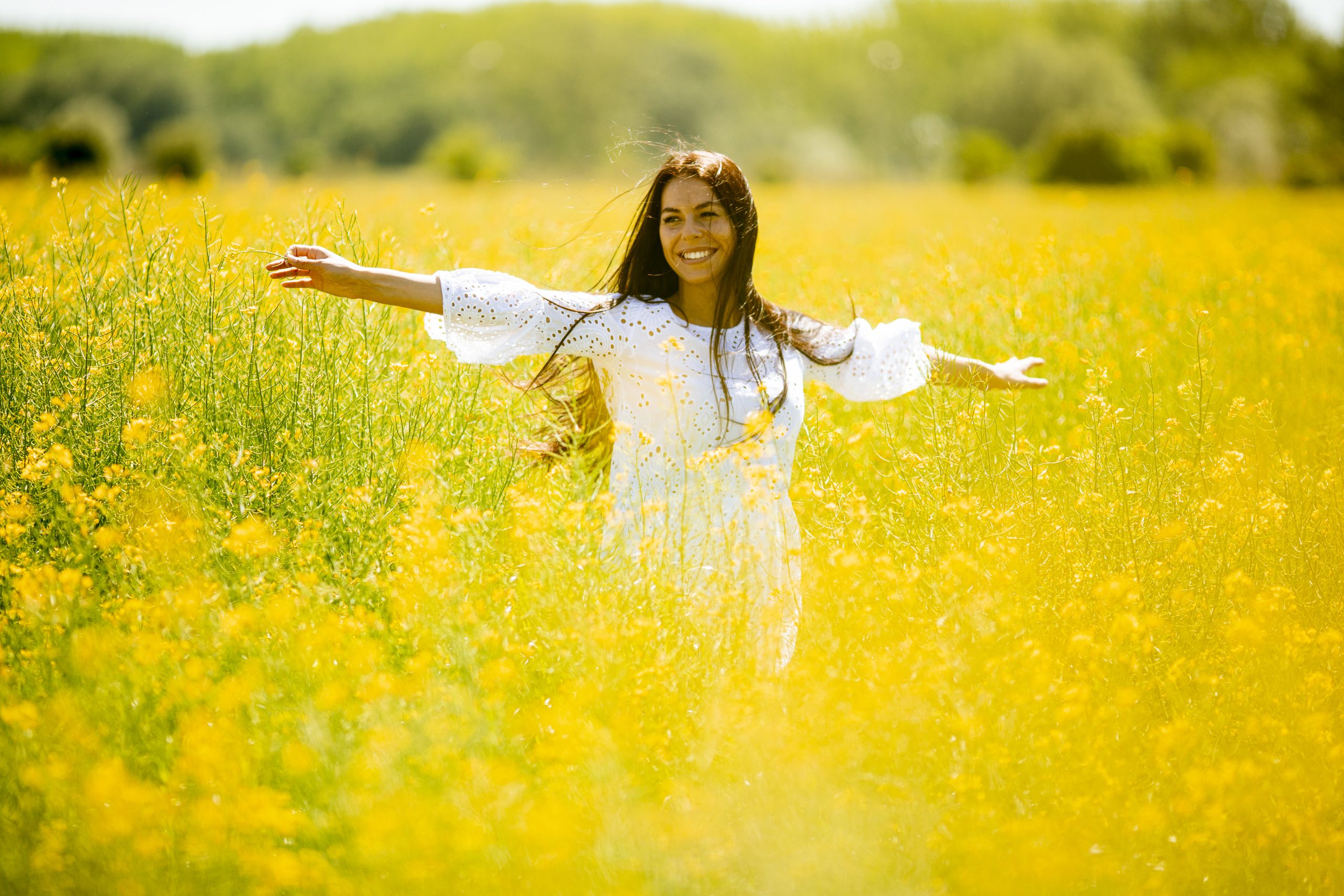 Young woman in the rapeseed field